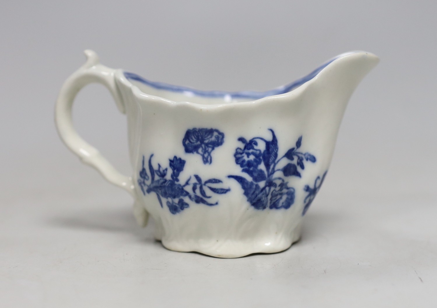 An 18th century Caughley Low Chelsea ewer printed with flowers, 6.5 cms high